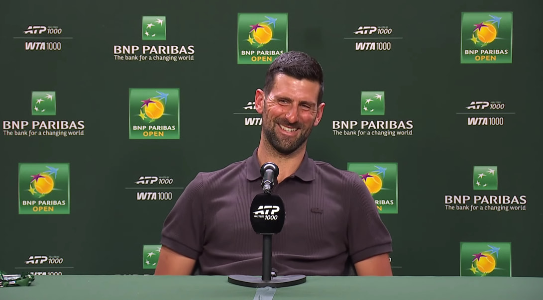 Novak Djokovic sonriendo en rueda de prensa de Indian Wells 2026 hablando sobre la Next Gen.