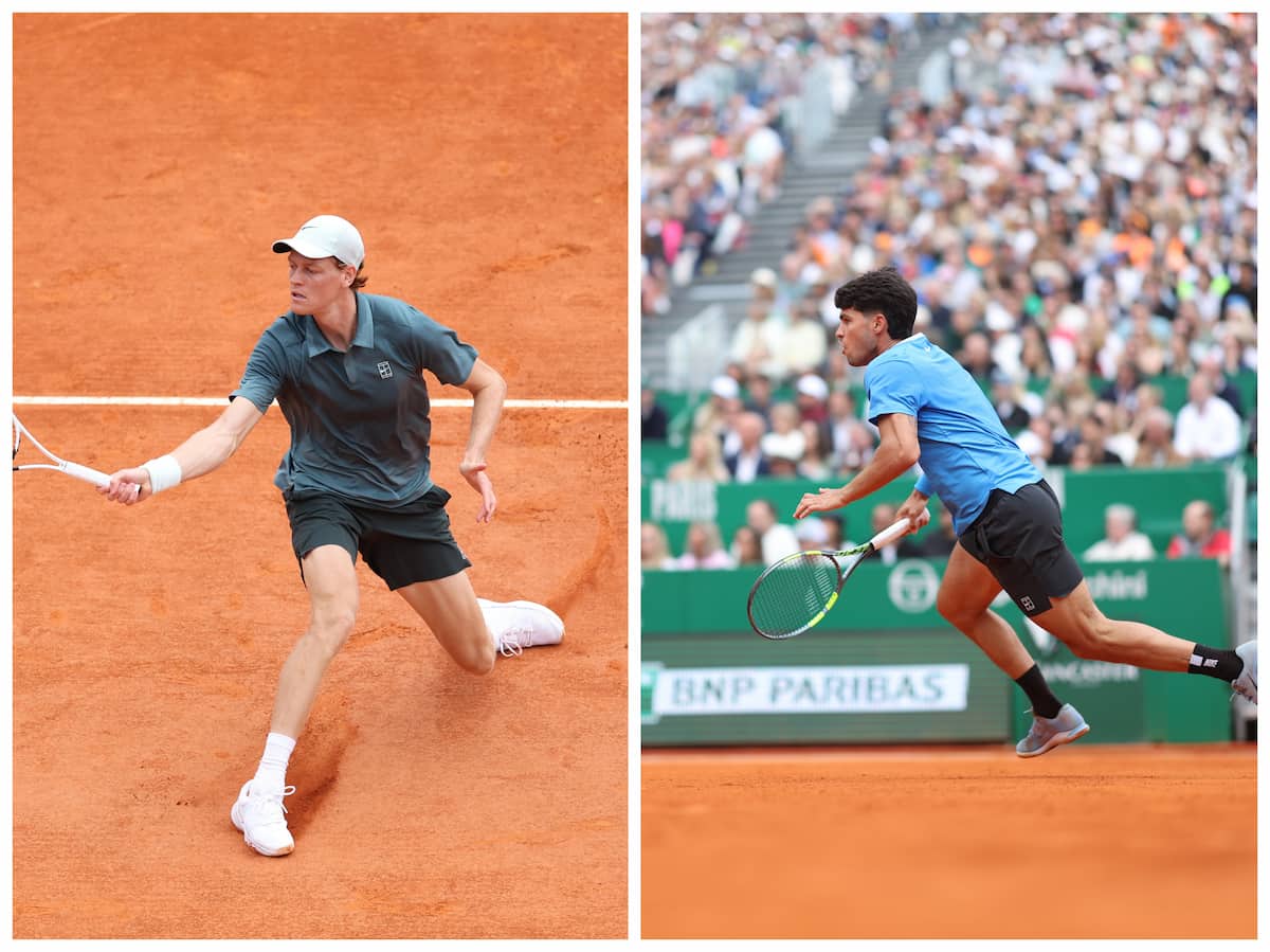 Carlos Alcaraz con gesto de preocupación tocándose la muñeca en la pista.
